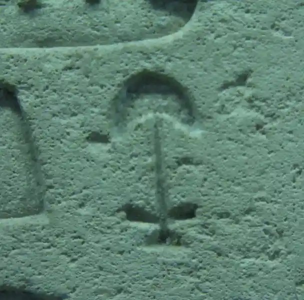 Crescent on top of a cross symbol on the false door of Sheshi